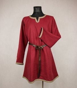 A rich early medieval linen shirt decorated with hand-woven woollen tablet trim