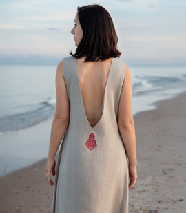 Linen dress with a cutout on the back and Slavic embroidery of the goddess Mokosz