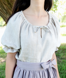 Rustic linen blouse with gathered neckline and puffed sleeves