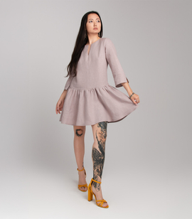 Loose linen mini dress with 3/4 sleeves, low waist and ruffle at the bottom